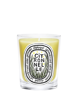 Candela Diptyque Citronnelle 190 g in bicchiere trasparente con etichetta colorata, fragranza lemongrass, verbena, neroli e fiori d’arancio.